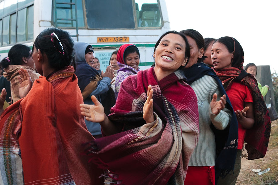   Women returning to there home town near Kigwema   Starting a spontaneous dance